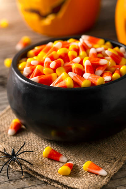 istock Bowl of Halloween Candy Corns and Jack O' Lantern 1166893591
