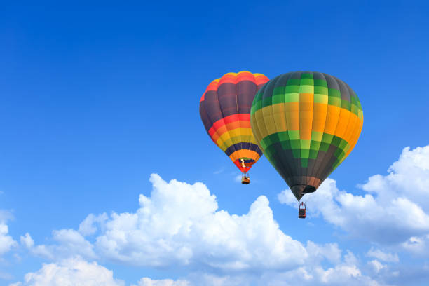 istock Colorful Hot Air Balloons in Flight over blue sky 1166894156