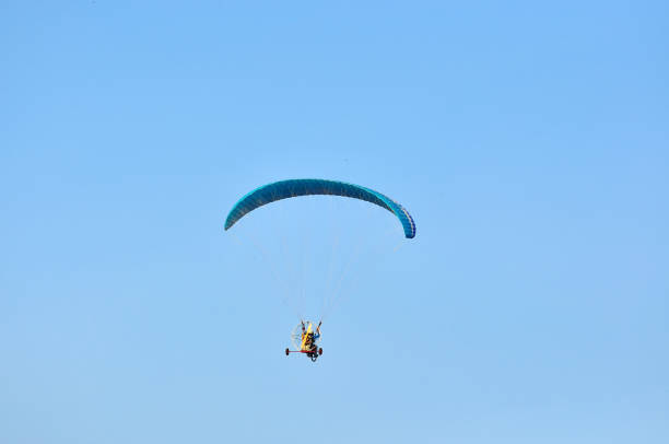 istock Paragliding in the sky 1166894168