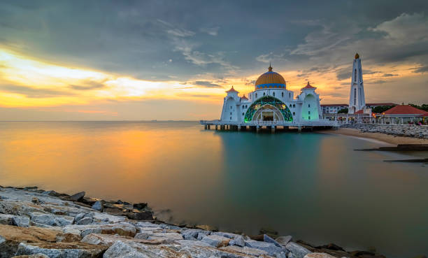 istock Panoramic view of floating public mosque during awesome sunset 1166894361