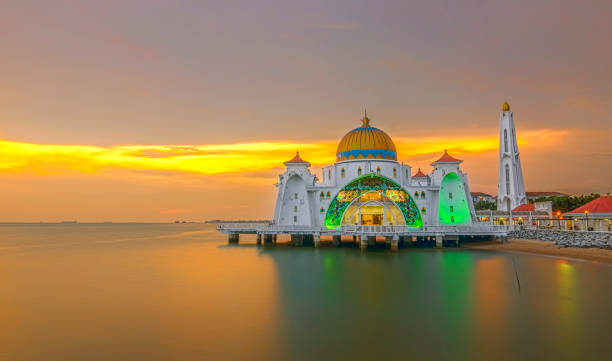 istock Panoramic view of floating public mosque during awesome sunset 1166894364