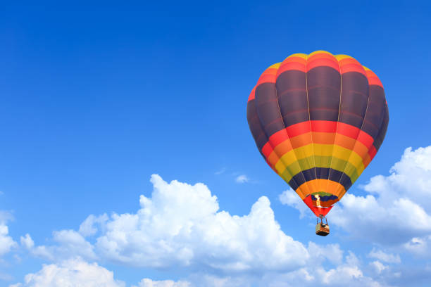 istock Colorful Hot Air Balloons in Flight over blue sky 1166896242