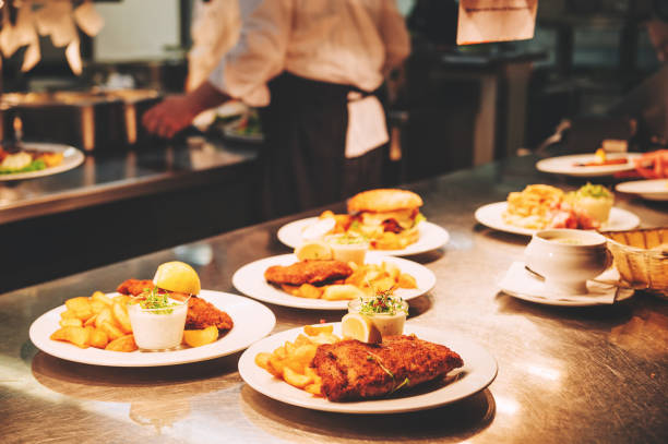 istock Food orders on the kitchen table in the restaurant 1166898083