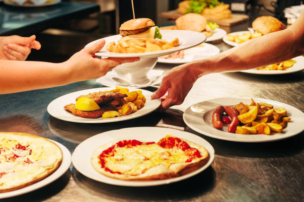 istock Food orders on the kitchen table in the restaurant 1166898105