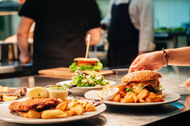 istock Food orders on the kitchen table in the restaurant 1166898635