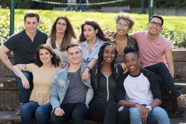 istock College students in a group photo outside 1166900818