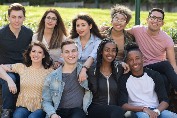 istock College students in a group photo outside 1166900827