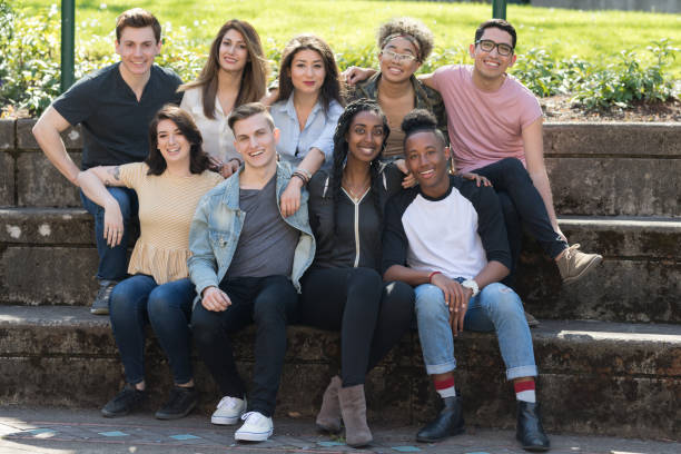 istock College students in a group photo outside 1166900828