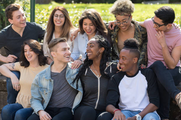 istock College students in a group photo outside 1166900833