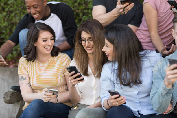 istock Diverse group of college students using smart phones 1166900915