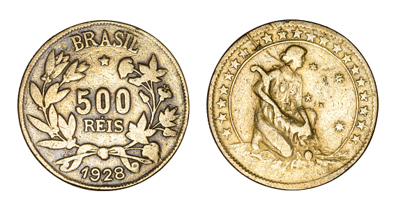 A 1 Euro Coin held next to a 1 Pound Coin.