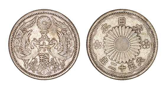Japanese coin 50 sen from Taishoo Era (1923), the one sen coin was a Japanese coin worth one-hundredth of a Japanese yen, front and back face isolated on white background with clipping path