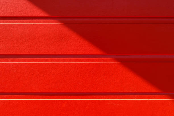 Red Timber Wall Detail With Sunlight And Shadow