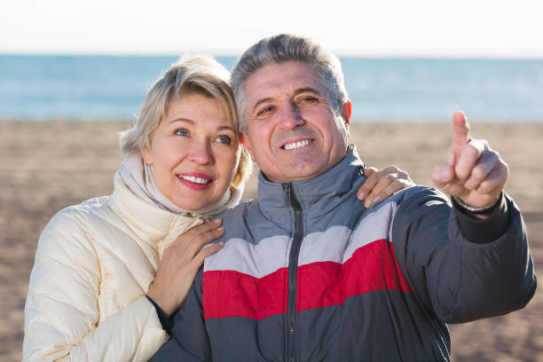 istock Couple walk and husband points to something 1166906128