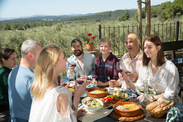 istock Adults enjoying dinner outdoor 1166906979