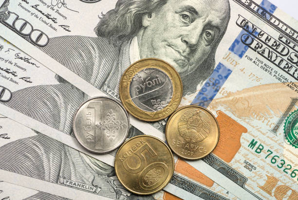 istock Belarusian coin on top of dollar bills 1166908092