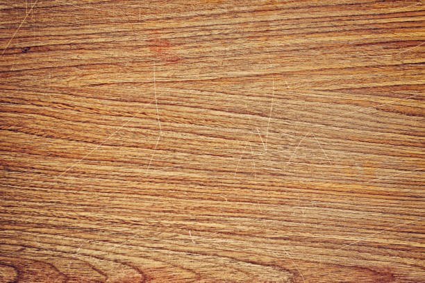 istock Old wood office table top with scratch texture for background design 1166928478