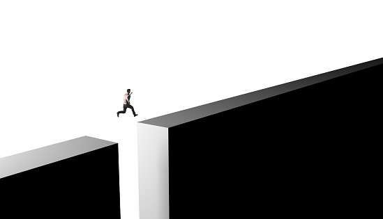 Businessman jumping from obstacles of life