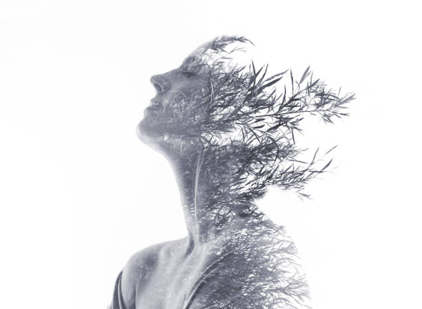istock Multiple Exposure of woman morphing into ornamental grass 1166938456