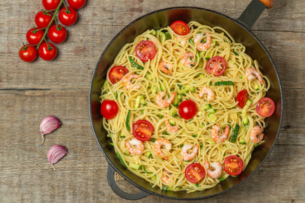 istock Pasta with shrimp and vegetables. The view from the top. Copy space. 1166940466