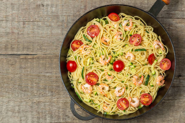 istock Pasta with shrimp and vegetables. The view from the top. Copy space. 1166940521
