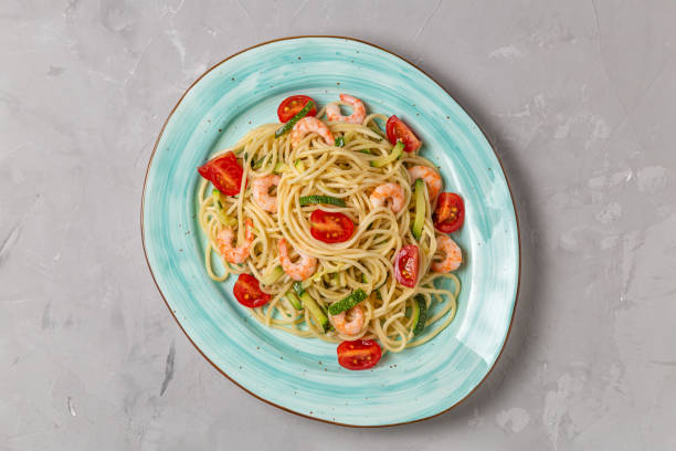 istock Pasta with shrimp and vegetables. The view from the top. Copy space. 1166940531