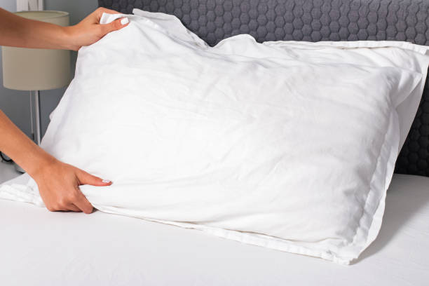 istock Woman's hands close-up making the bed. 1166940587