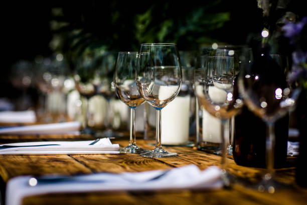 istock Luxury table settings for fine dining with and glassware, beautiful blurred  background. For events, weddings.  Preparation for holiday  Christmas and Hanukkah dinner night. props for weddings, birthdays, and celebrations. 1166941718