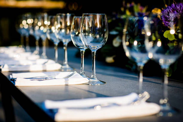 istock Luxury table settings for fine dining with and glassware, beautiful blurred  background. For events, weddings.  Preparation for holiday  Christmas and Hanukkah dinner night. props for weddings, birthdays, and celebrations. 1166941784