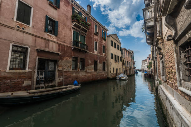 istock The green sky is reflected in the Venetian canal 1166943158