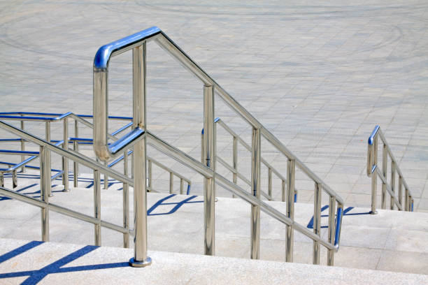 istock Stainless steel handrails and steps in a building 1166944138