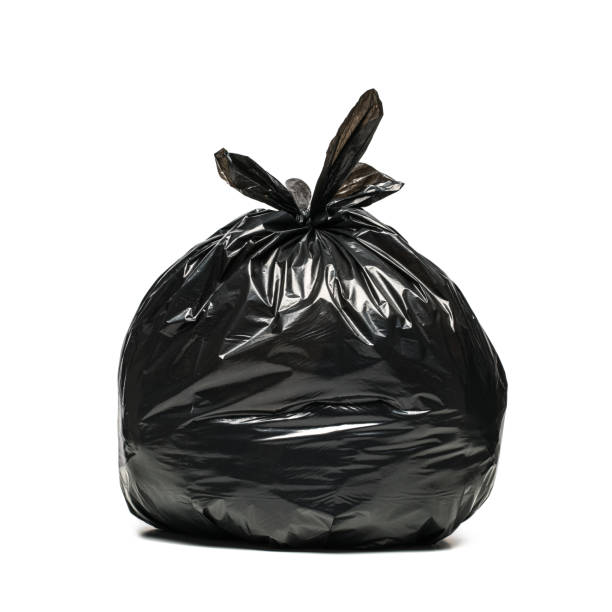 trash bag black garbage bag on a white background garbage bag stock pictures, royalty-free photos & images