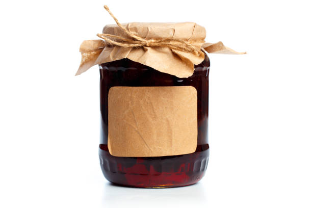 istock glass bottle with preserved food on white background 1166946916