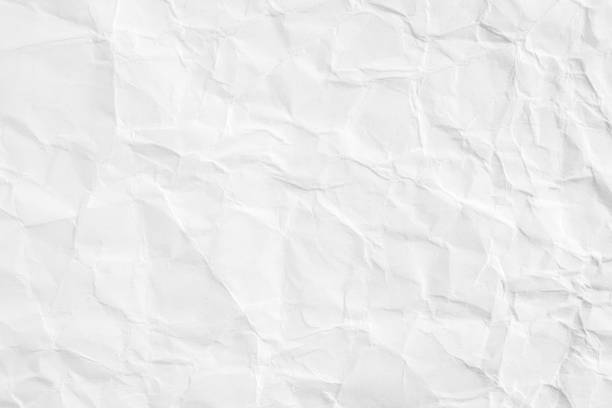 istock Closeup white blank crumpled paper texture background. 1166947485
