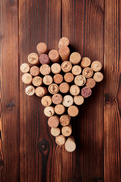 istock wine corks, grapevine, free copy space on wooden background - Image 
