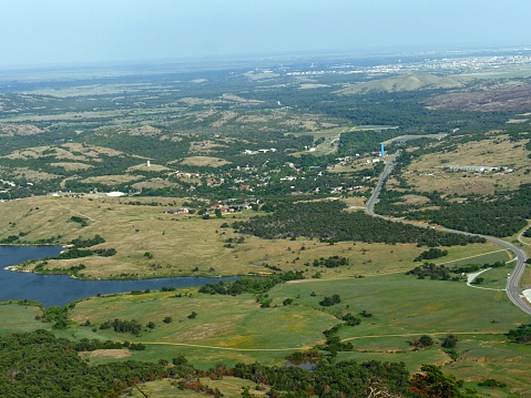 Aerial wide view of Medicine Park and part of Lake Lawtonka seen from peak of Mt. Scott, Oklahoma, USA.