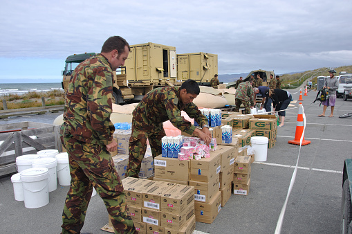 Christchurch, New Zealand, February 22, 2011:  Soldiers from the NZ Defence Forces provide desalinated water at New Brighton for people after the 6.4 magnitude earthquake on February 22, 2011 in Christchurch, New Zealand