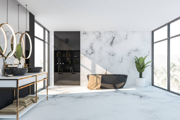 istock Black and white bathroom interior, tub and sink 1166960472