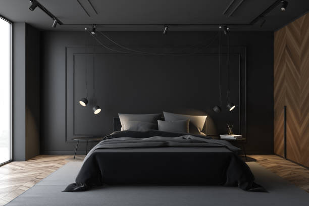 istock Black and wooden master bedroom interior 1166961331