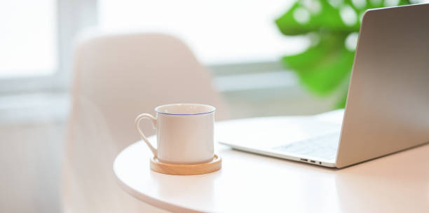 istock Minimal comfortable workplace with a cup of coffee 1166971423