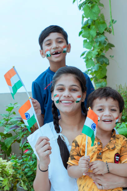 istock indian children holding national Indian flag with pride 1166973705