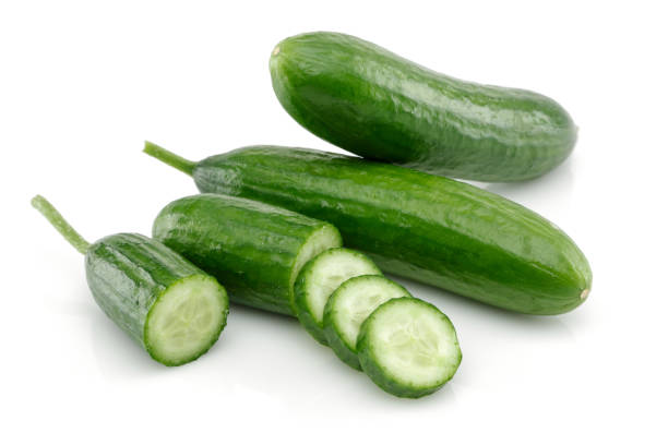 istock Fresh cucumber with slices isolated on white 1166974822
