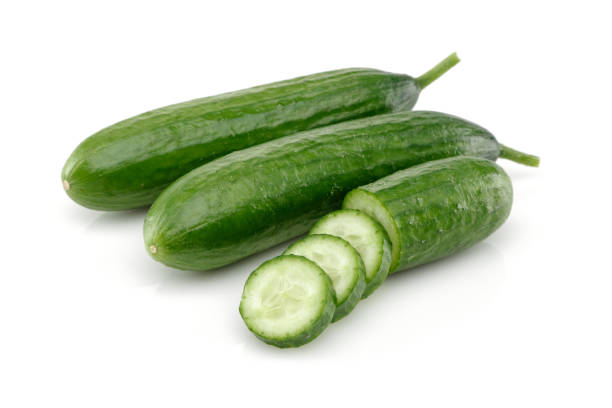 istock Fresh cucumber with slices isolated on white 1166974907