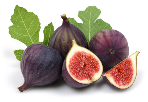 istock Fresh purple fig fruit and slice with leaf isolated 1166975495