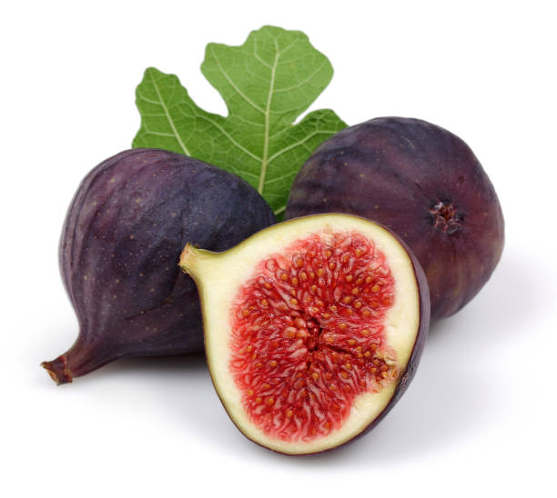 istock Fresh purple fig fruit and slice with leaf isolated 1166976257