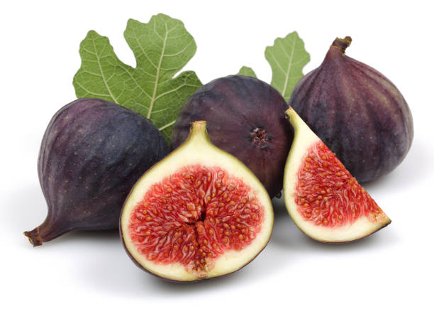 istock Fresh purple fig fruit and slice with leaf isolated 1166976288