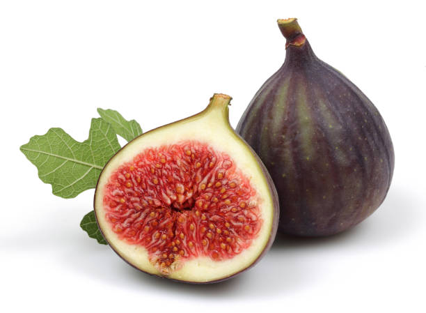 istock Fresh purple fig fruit and slice with leaf isolated 1166976385