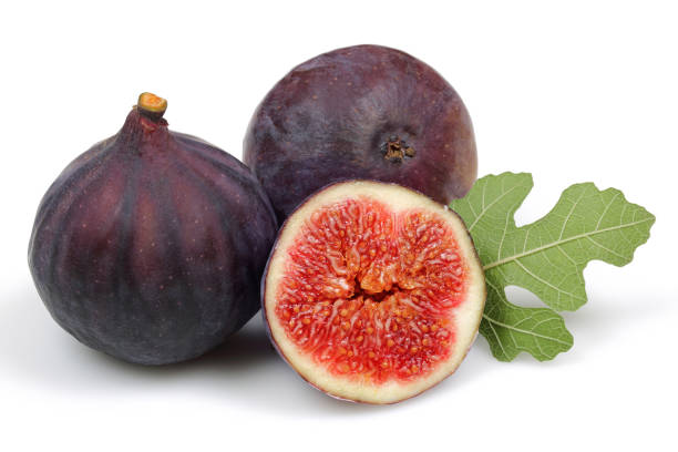 istock Fresh purple fig fruit and slice with leaf isolated 1166976390