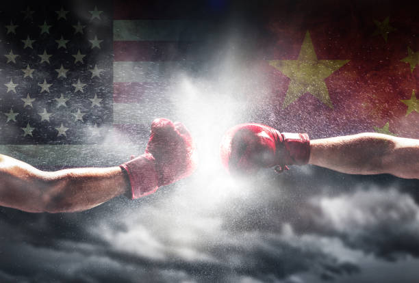 istock USA vs China. Two boxing gloves punch 1166976536