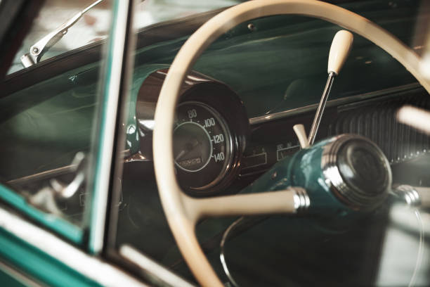 istock Retro car steering wheel and dashboard 1166977383